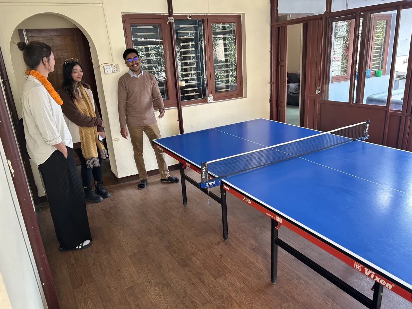 Colleagues by the ping-pong table in the office