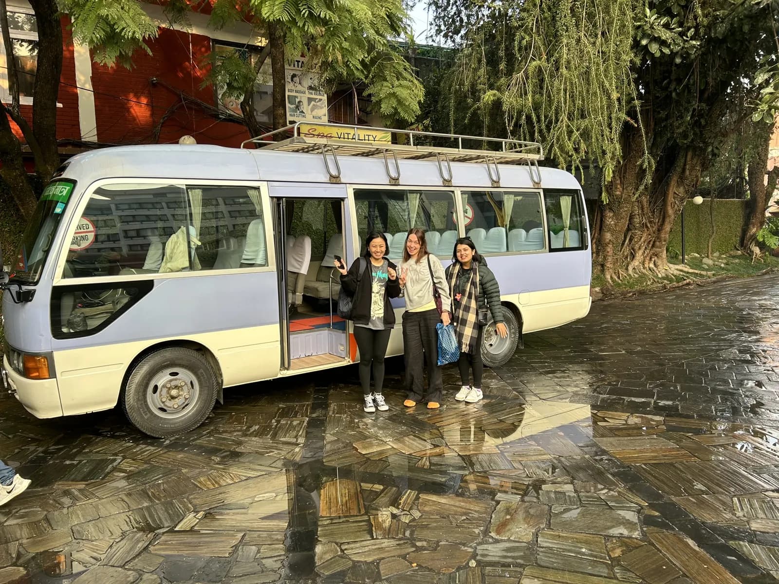 Colleagues by the minibus on a team trip